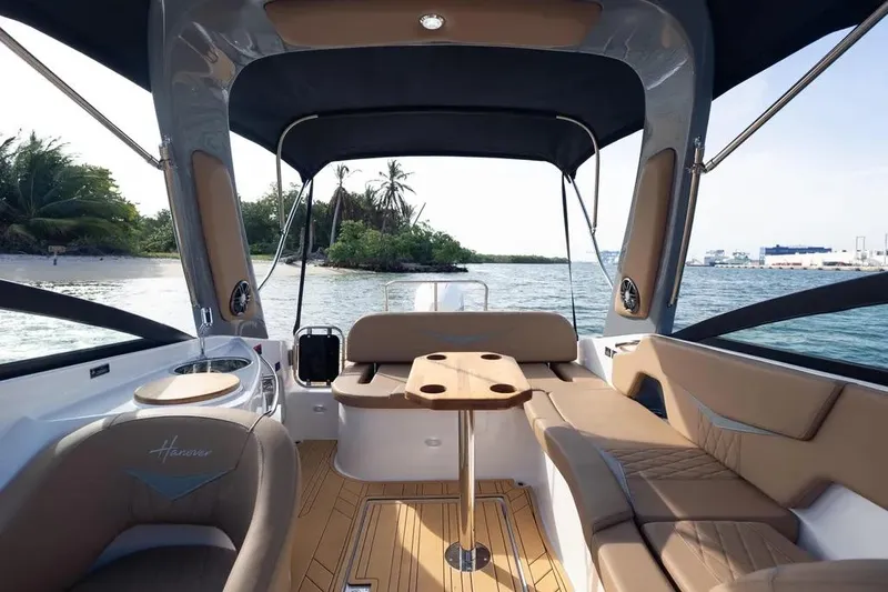  Yacht Photos Pics Luxurious 2025 Hanover 255 boat interior with elegant seating and scenic ocean view.