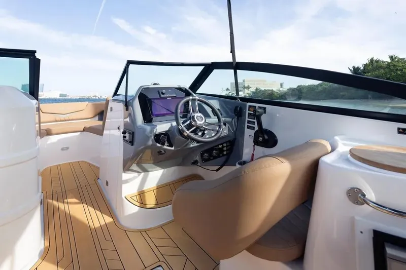  Yacht Photos Pics Interior of 2025 Hanover 255 boat with modern steering and luxurious seating.