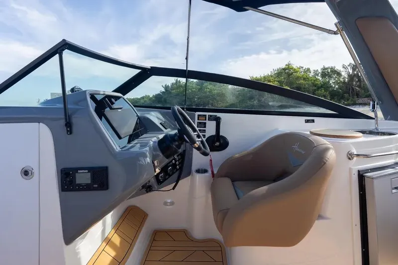  Yacht Photos Pics Interior of 2025 Hanover 255 boat with modern steering and seating.