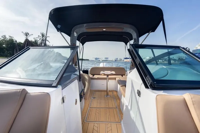  Yacht Photos Pics 2025 Hanover 255 boat interior with tan seating and open water view.