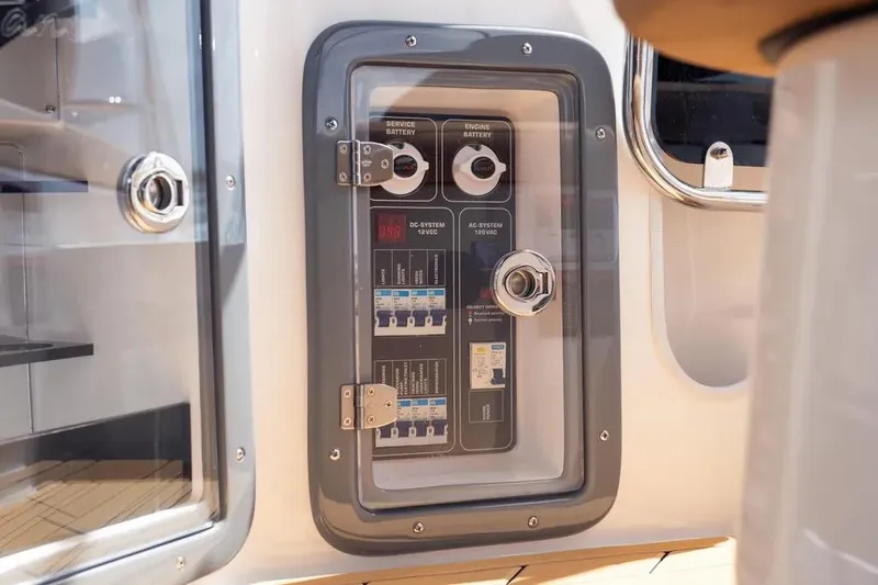  Yacht Photos Pics Electrical panel on a 2025 Hanover 255 boat, featuring battery and system controls.