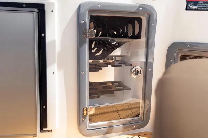  Yacht Photos Pics 2025 Hanover 255 boat interior with storage compartment and secure latch.