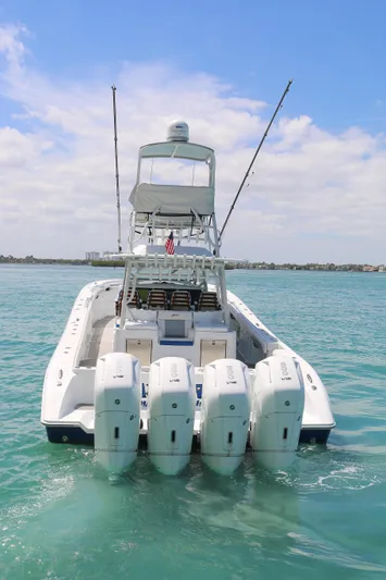 Alegria Yacht Photos Pics 2021 Yellowfin 54 Offshore boat with four engines on open water.
