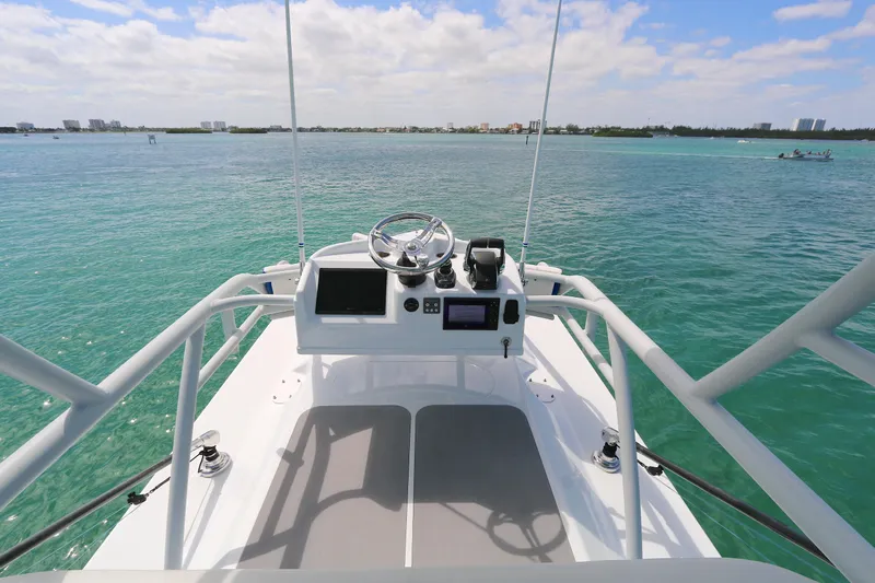 Alegria Yacht Photos Pics 2021 Yellowfin 54 Offshore boat helm with ocean view and clear skies.