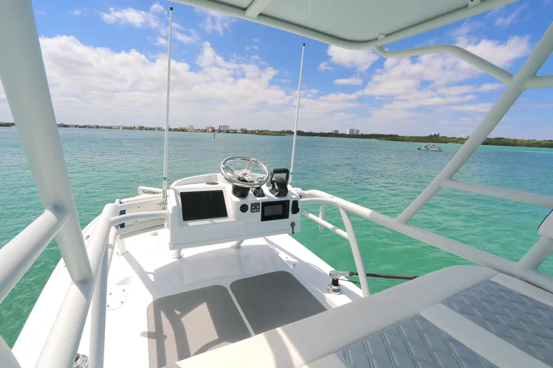 Alegria Yacht Photos Pics 2021 Yellowfin 54 Offshore boat helm with ocean view and clear skies.