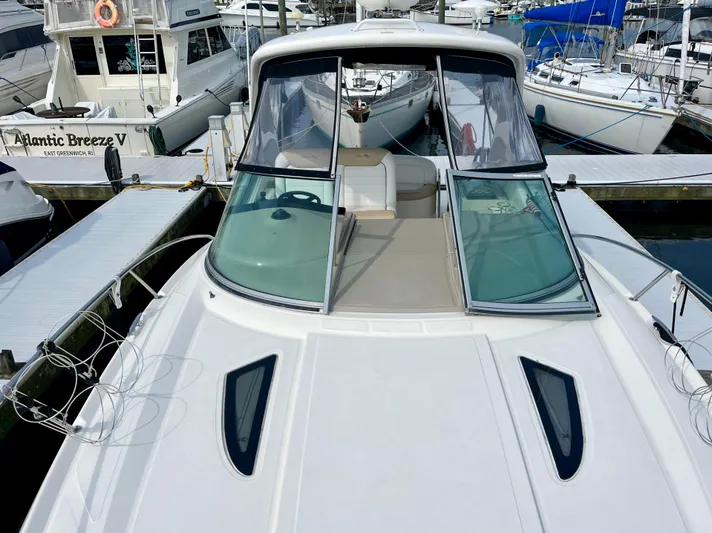 Sar Erinity Yacht Photos Pics 2009 Sea Ray 310 Sundancer docked at marina, showcasing sleek design and spacious deck.