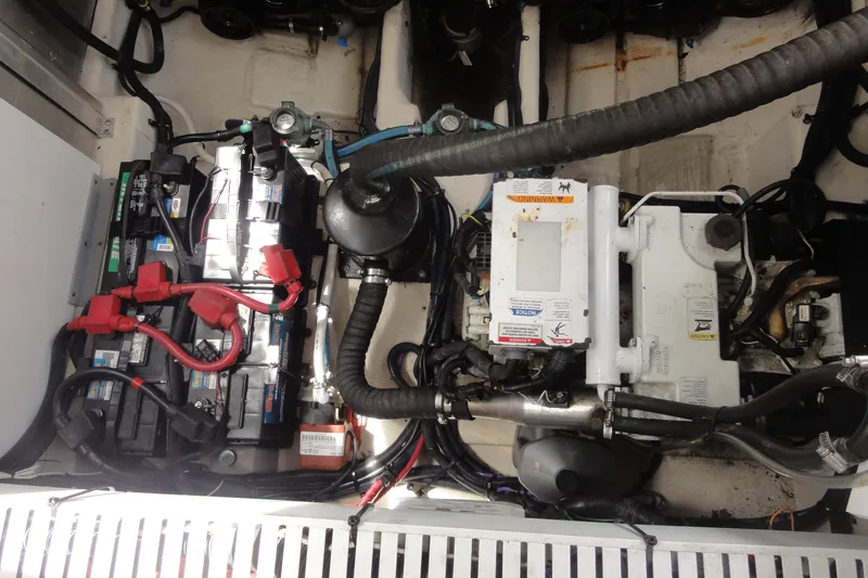 Sar Erinity Yacht Photos Pics Engine compartment of a 2009 Sea Ray 310 Sundancer with visible batteries and wiring.