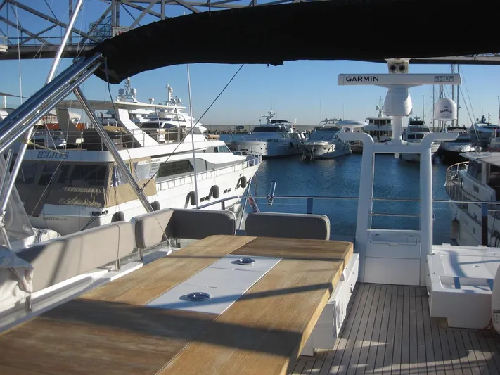  Yacht Photos Pics Luxurious 2015 Fairline Squadron 65 yacht docked at a marina, featuring spacious deck seating.