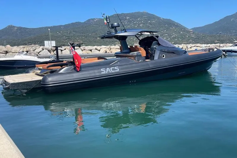 Nabu Yacht Photos Pics 2023 SACS Strider 15 luxury boat docked in a scenic marina.