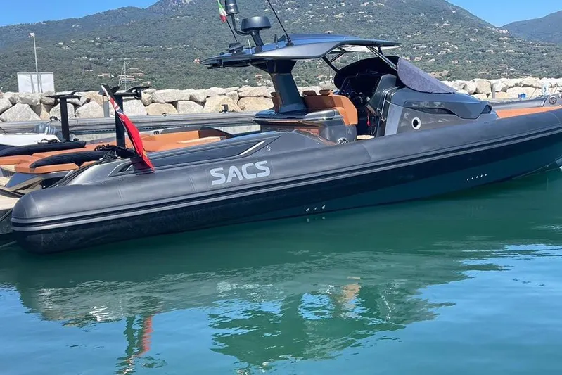 Nabu Yacht Photos Pics 2023 SACS Strider 15 luxury boat docked in a scenic marina.