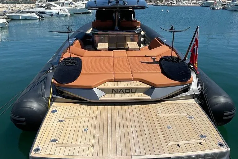 Nabu Yacht Photos Pics Luxury SACS Strider 15 yacht, 2023 model, docked in a marina with sunbathing area.