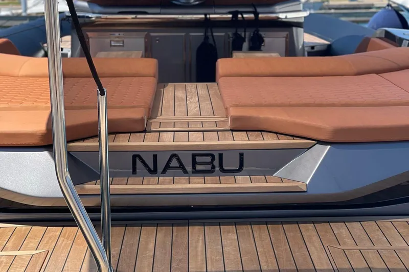Nabu Yacht Photos Pics 2023 SACS Strider 15 yacht with teak deck and cushioned seating.