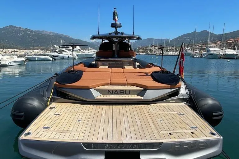 Nabu Yacht Photos Pics 2023 SACS Strider 15 luxury yacht docked in a scenic marina.