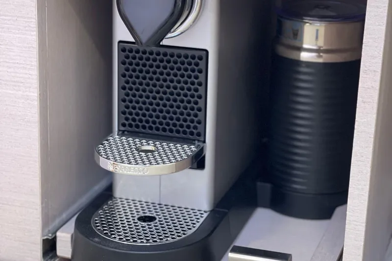 Nabu Yacht Photos Pics Nespresso machine in SACS Strider 15 yacht, 2023 model, with sleek design.