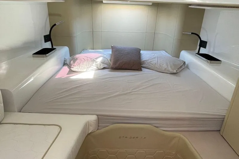 Nabu Yacht Photos Pics Luxurious interior cabin of 2023 SACS Strider 15 yacht with cozy bed and modern lighting.