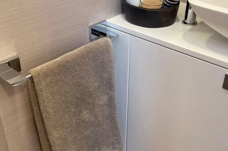 Nabu Yacht Photos Pics Modern bathroom detail on 2023 SACS Strider 15 yacht, featuring towel and sink area.