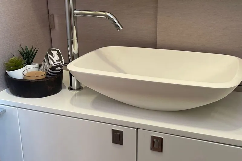 Nabu Yacht Photos Pics Modern bathroom sink with sleek faucet on SACS Strider 15 yacht, 2023 model.
