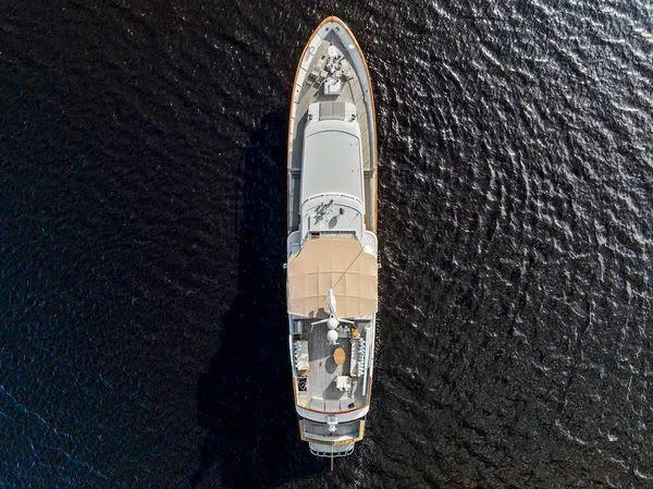 Chanticleer Yacht Photos Pics Aerial view of 1973 Burger 310C yacht on dark water.
