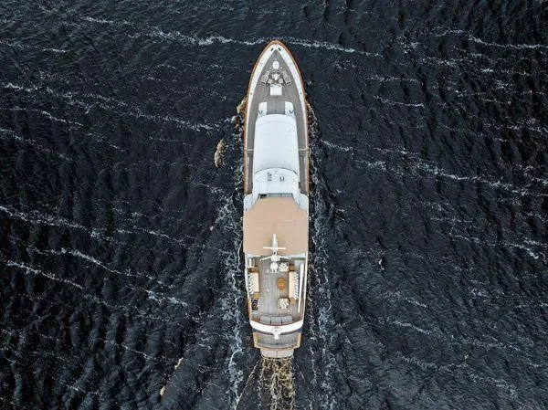 Chanticleer Yacht Photos Pics Aerial view of 1973 Burger 310C yacht cruising on dark water.