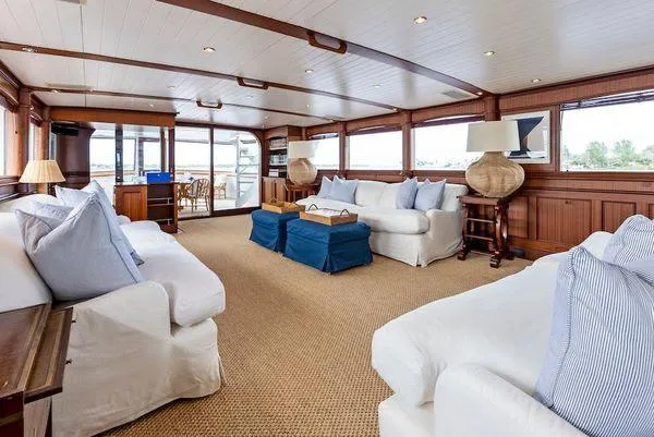 Chanticleer Yacht Photos Pics Luxurious 1973 Burger 310C yacht interior with elegant seating and panoramic windows.