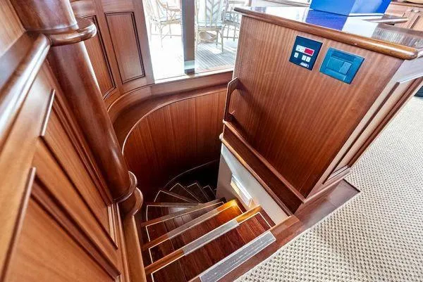 Chanticleer Yacht Photos Pics Wooden spiral staircase in a 1973 Burger 310C yacht interior.