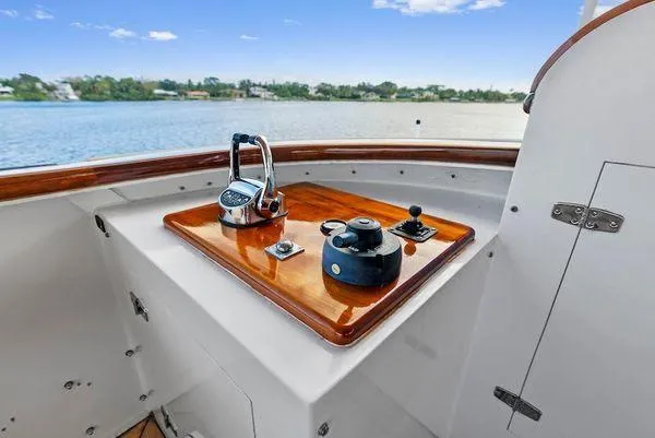 Chanticleer Yacht Photos Pics Control panel on a 1973 Burger 310C yacht, overlooking serene water.