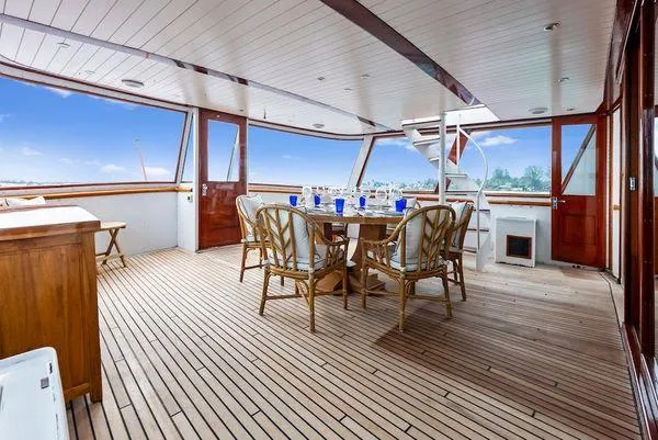 Chanticleer Yacht Photos Pics Spacious deck of 1973 Burger 310C yacht with dining area and scenic views.