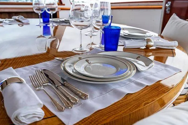 Chanticleer Yacht Photos Pics Elegant table setting on a 1973 Burger 310C yacht with fine china and glassware.