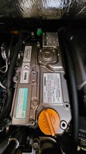  Yacht Photos Pics Engine of 1998 Hunter 340 Sloop sailboat, detailed view with labels and oil cap.