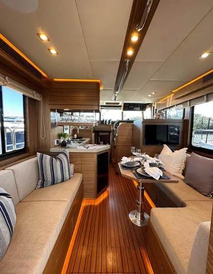 Nordhavn 41 Yacht Photos Pics Luxurious interior of 2022 Nordhavn 41 yacht with elegant seating and dining area.