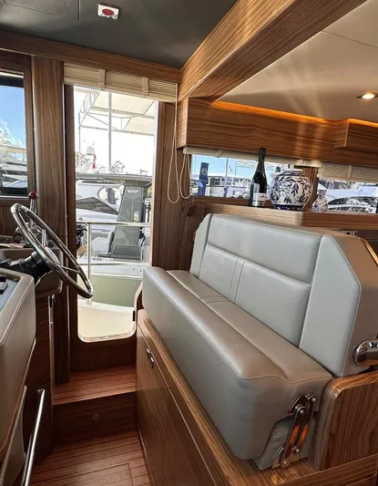 Nordhavn 41 Yacht Photos Pics Interior of 2022 Nordhavn 41 yacht with modern seating and wooden accents.