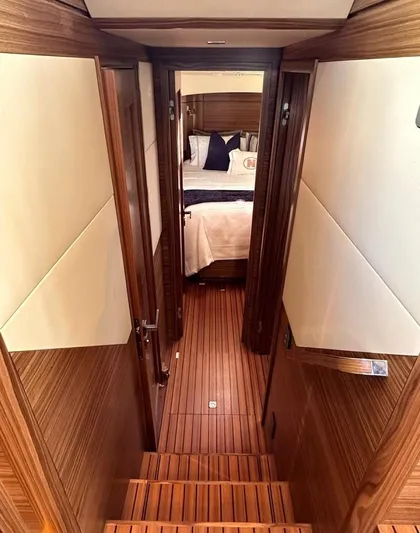 Nordhavn 41 Yacht Photos Pics Interior view of 2022 Nordhavn 41 yacht, featuring wooden flooring and cozy bedroom.