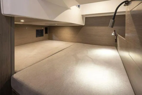 My Angel Yacht Photos Pics 2023 Beneteau Gran Turismo 32 cabin interior with modern lighting and cozy bedding.