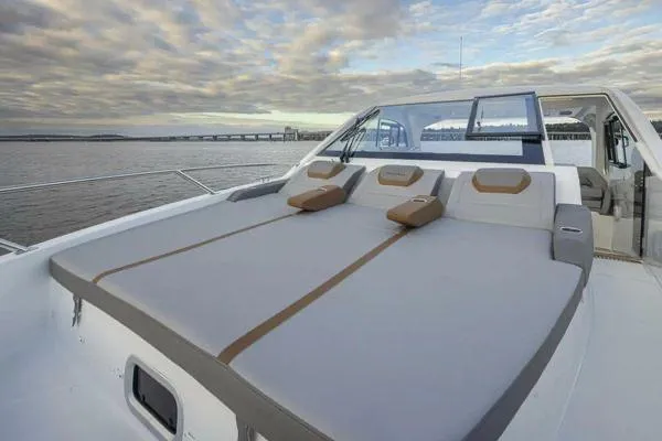 My Angel Yacht Photos Pics 2023 Beneteau Gran Turismo 32 yacht with spacious sunbathing deck, scenic water view.