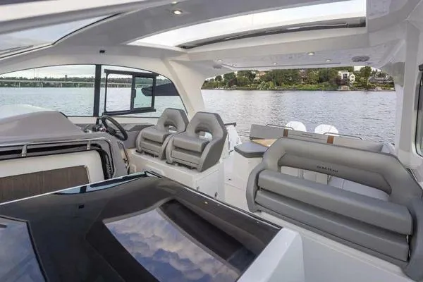 My Angel Yacht Photos Pics 2023 Beneteau Gran Turismo 32 yacht interior with modern seating and panoramic water view.