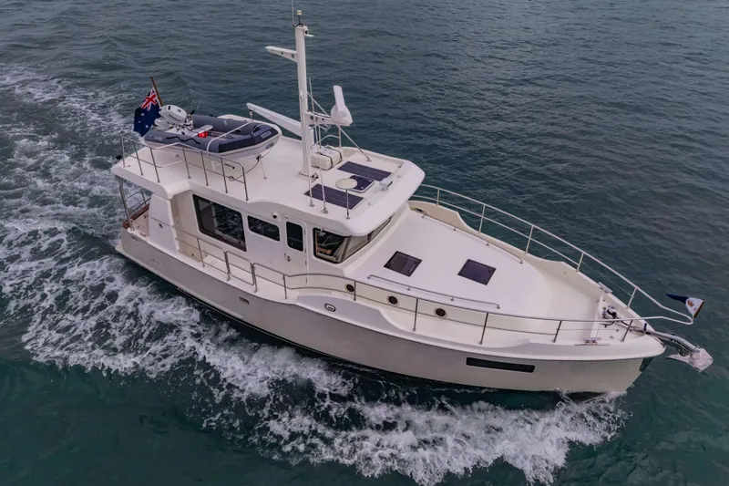 Nordhavn 41 Yacht Photos Pics 2023 Nordhavn 41 yacht cruising on open water, featuring sleek design and modern amenities.