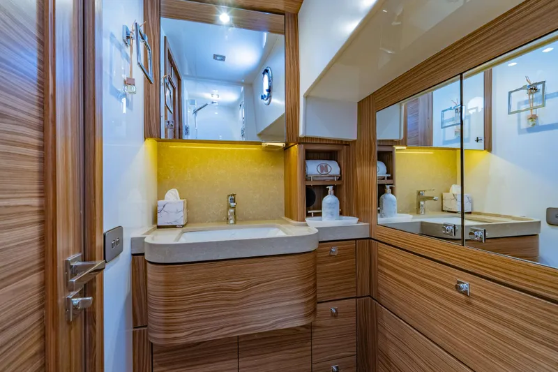 Nordhavn 41 Yacht Photos Pics Luxurious bathroom interior of 2023 Nordhavn 41 yacht with wood accents and modern fixtures.