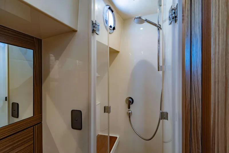 Nordhavn 41 Yacht Photos Pics Luxurious shower area in 2023 Nordhavn 41 yacht, featuring modern fixtures and wood accents.