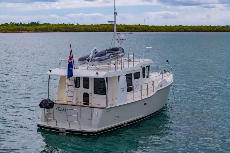 Nordhavn 41 Yacht Photos Pics 2023 Nordhavn 41 yacht on calm water, featuring a sleek design and modern amenities.