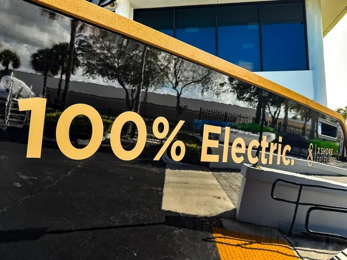  Yacht Photos Pics 2023 X Shore Eelex 8000 electric boat with '100% Electric' sign.