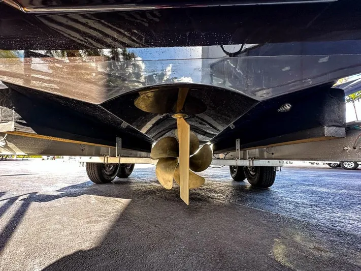  Yacht Photos Pics Propeller and hull of 2023 X Shore Eelex 8000 electric boat on trailer.