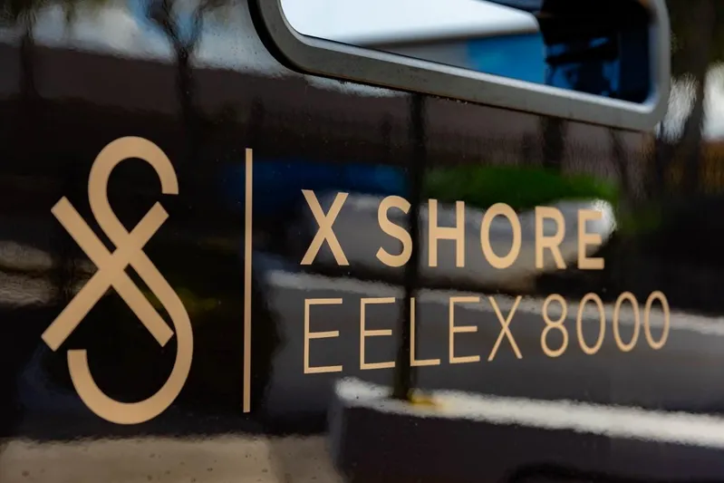  Yacht Photos Pics 2023 X Shore Eelex 8000 logo on boat exterior.