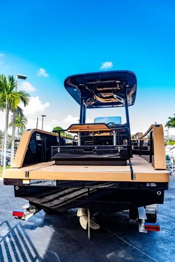  Yacht Photos Pics 2023 X Shore Eelex 8000 electric boat, rear view, docked under clear blue sky.