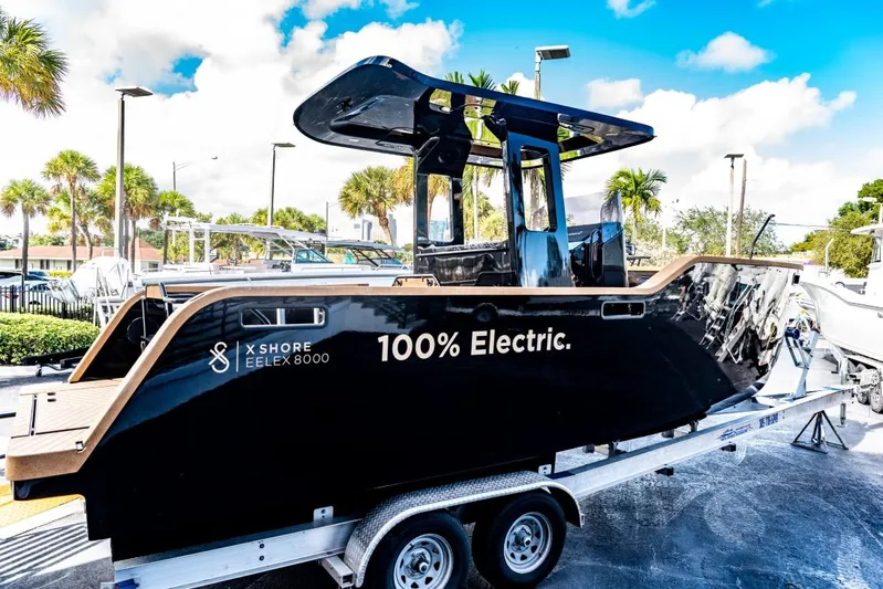  Yacht Photos Pics 2023 X Shore Eelex 8000 electric boat on a trailer under a bright blue sky.