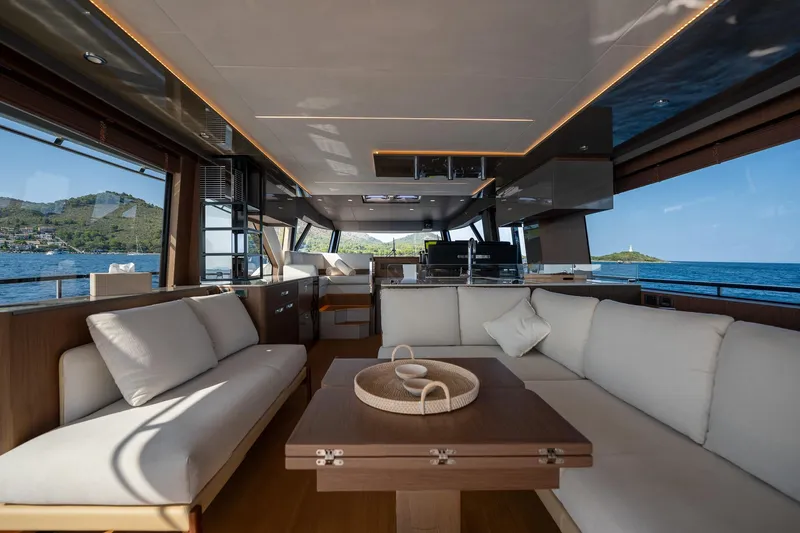  Yacht Photos Pics Luxurious interior of 2023 Prestige X60 yacht with ocean view and elegant seating.