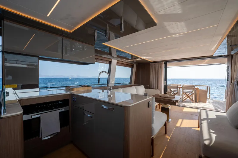  Yacht Photos Pics Luxurious interior of 2023 Prestige X60 yacht with ocean view and modern kitchen.