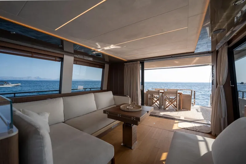  Yacht Photos Pics Luxurious interior of 2023 Prestige X60 yacht with ocean view and elegant furnishings.