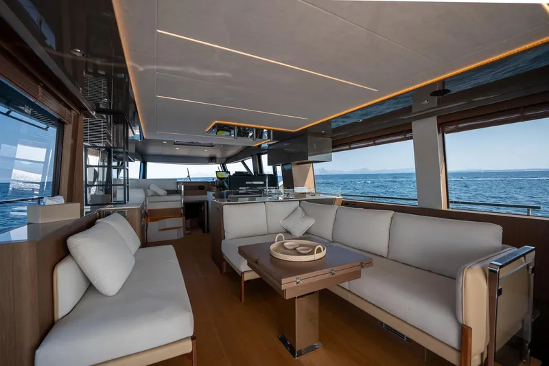  Yacht Photos Pics Luxurious interior of 2023 Prestige X60 yacht with elegant seating and ocean view.