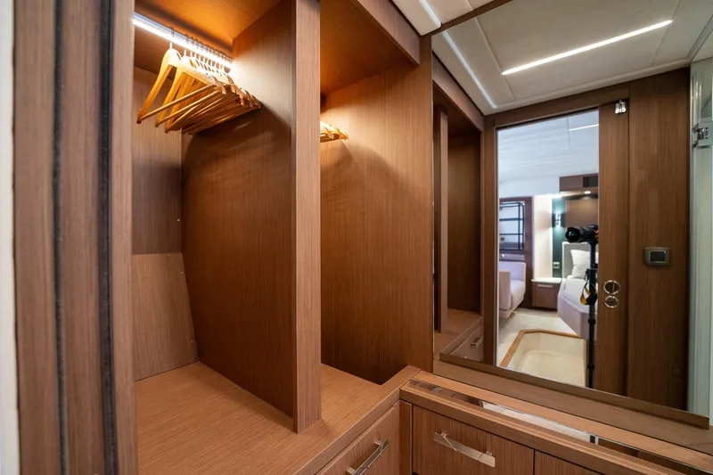  Yacht Photos Pics Luxurious wooden wardrobe interior in 2023 Prestige X60 yacht cabin.