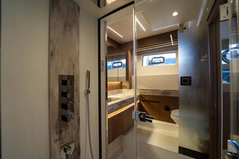  Yacht Photos Pics Luxurious bathroom interior of 2023 Prestige X60 yacht with modern fixtures and elegant design.